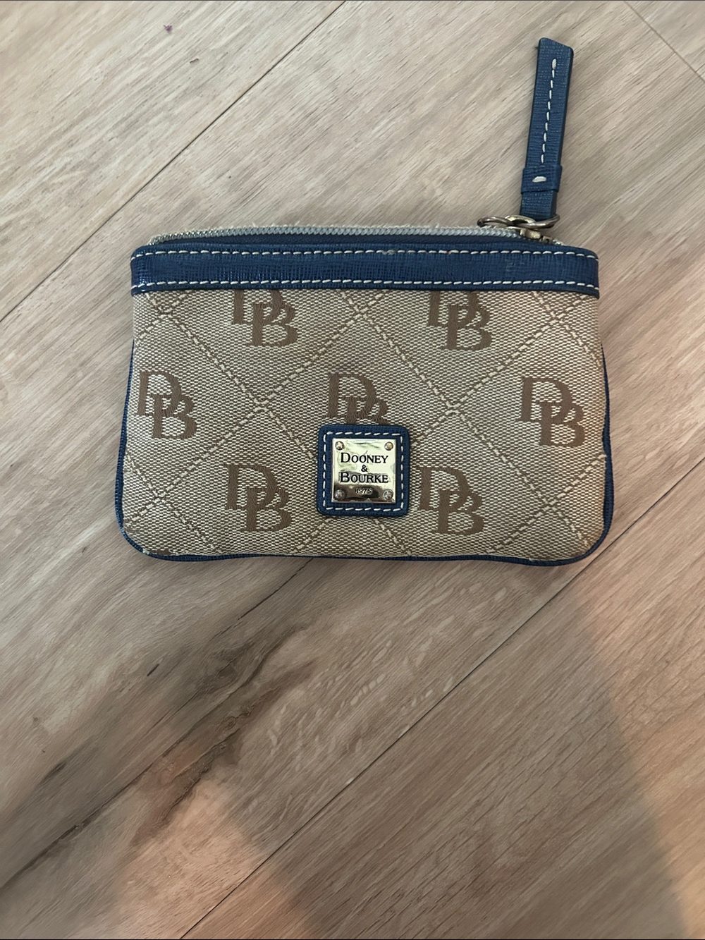 Dooney & Bourke Beige Canvas Wristlet with Navy Trim and Logo